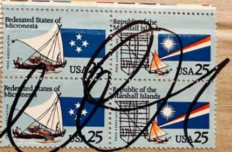 Modern stamps with thick black marker cancellations